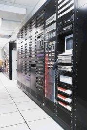 Photo of bank of shelves holding computers and related equipment